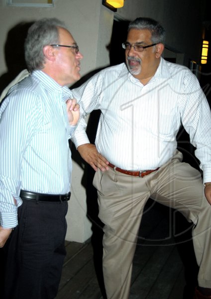 Winston Sill / Freelance Photographer
Departing British High Commissioner Jeremy Cresswell (left), 'hol a reason' with attorney Derek Jones at Spanish Court Hotel, New Kingston on Wednesday.

******************************************************************************* december 2, 2009.