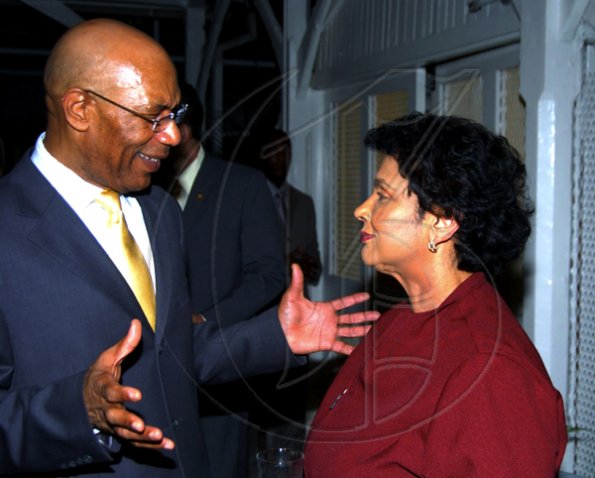 Winston Sill / Freelance Photographer
Governor General Sir Patrick Allen is animated as he talks with Guardsman CEO Valerie Juggan-Brown at the Consular Corps of Jamaica event.

presents High Tea and Unveiling of Plaque, held at King's House, Hope Road on Thursday January 21, 2010.