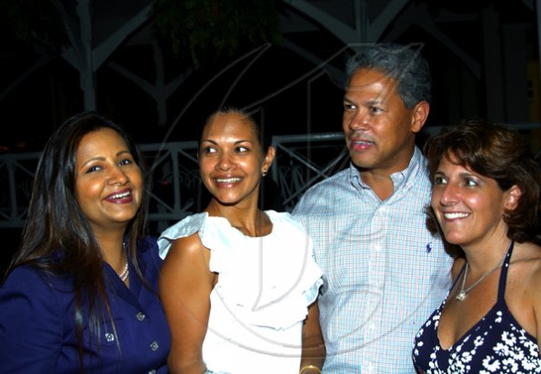 Winston Sill / Freelance Photographer
Donovan Perkins and wife Michelle (right) chill with Sheila Benjamin-McNeill (left) and Aloima Suarez.

The Consular Corps of Jamaica presents High Tea and Unveiling of Plaque, held at King's House, Hope Road on Thursday January 21, 2010.