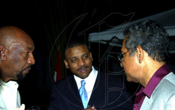 Winston Sill / Freelance Photographer
Cuban Ambassador Yuri Gala Lopez (centre) hobnobs with Deputy Prime Minister Dr Ken Baugh (right) and Health Minister Ruddy Spencer at the Cuban National Day Reception, held at Millsborough Avenue on Friday night January 8, 2010.