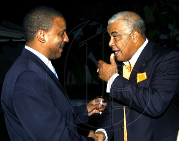 Winston Sill / Freelance Photographer
Cuban Ambassador Yuri Gala Lopez (left) welcomes PNP Chairman Robert Pickersgill.

 host National Day Reception, held at Millsborough Avenue on Friday night January 8, 2010.