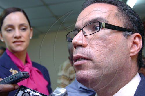 Rudolph Brown/Chief Photographer
Daryl Vaz and wife Ann-Marie speaks to members of the media after the Circuit Court ruling of the Dabdoub/Vaz case at the Jamaica Labour Party Headquarter on Friday, February 27-2009.
