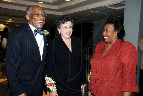 Colin Hamilton/freelance photographer
Professor Errol Morrison, president of the  University of Technology,  and wife Dr. Fay Whitbourne- Morrison (centre), chat with Justice Minister Senator Dorothy Lightbourne before the banquet at the Lay Magistrates Association of Jamaica's annual banquet at the Hilton Kingston Jamaica Hotel on Saturday September 26.

**********************************************************, 2009.
