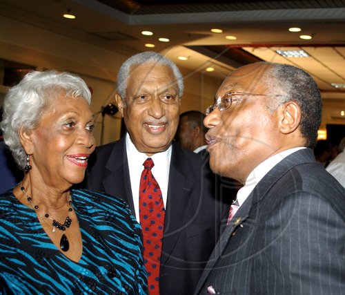 Winston Sill / Freelance Photographer
Professor Errol Morrison (right), hobnobs with Ken Jones and his wife Gloria Jones.
**************************************************************************

The Edward Seaga Research Institute presents the official launch of two books, "Revelations and The Grenada Intervention", by Edward Seaga, held at the Hilton Kingston Hotel, New Kingston on Wednesday September 23, 2009.