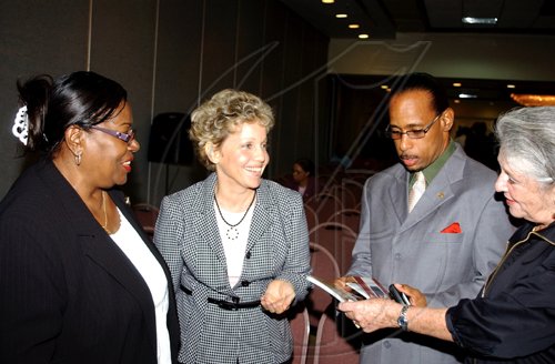 Winston Sill / Freelance Photographer
Carla Seaga (second left) jokes with Jeanette Grant- Woodham (left) Sue McManus and Kenneth Shaw.
*********************************************************************

The Edward Seaga Research Institute presents the official launch of two books, "Revelations and The Grenada Intervention", by Edward Seaga, held at the Hilton Kingston Hotel, New Kingston on Wednesday September 23, 2009.