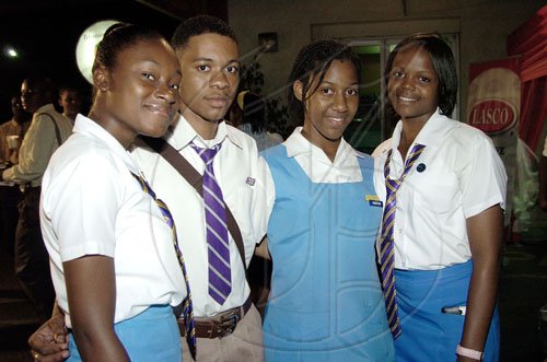Peta-Gaye Clachar/Staff Photographer
Ardenne High School girlKerryann Reid (left), Shereece Anglin and Sasha-Gaye McLean (right) sandwiched Paul Jones from KC at the TVJ School Challenge Quiz Finals at TVJ Studios on Tuesday, March 31, 2009.