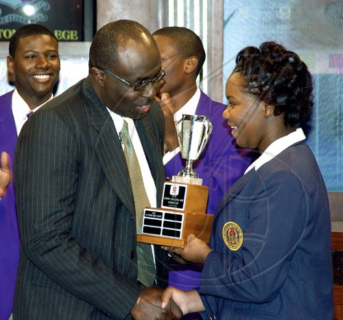Peta-Gaye Clachar/Staff Photographer
Gary Allen, managing director of the RJR Communications Group makes a presentation to a member of the Ardenne High School team at Tuesday's School Challenge Quiz Finals at TVJ Studios.
**************************************************************************************************** on Tuesday, March 31, 2009.
