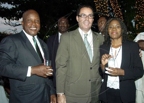 Peta-Gaye Clachar/Staff Photographer
Daryl Vaz is sandwiched by his Constituency manager Paul Young (left) and Councillor for Race Cource Division Pauline Reynolds at the after swearing in party for MP for West Portland Daryl Vaz at the Terra Nova Hotel on Tuesday, March 31, 2009.