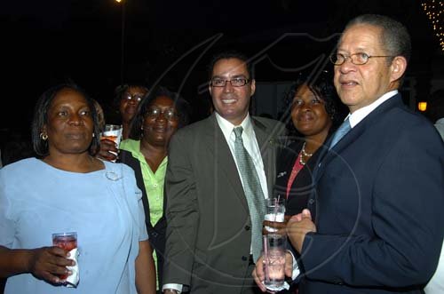 Peta-Gaye Clachar/Staff Photographer
Daryl Vaz (center) along with Prime Minister Bruce Golding mingles with some the constituency workers from Portland at the after swearing in party for MP for West Portland Daryl Vaz at the Terra Nova Hotel on Tuesday, March 31, 2009.