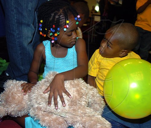 Peta-Gaye Clachar/Staff Photographer
Janielle Robinson (left) and Rajhiem Blake seems to be having baby talk at the Dudley Grant Memorial Trust Early Childhood 2009 Development Expo at the Jamaica Pegasus on Tuesday, July 7, 2009.