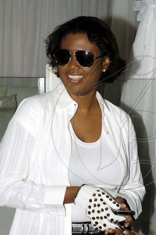 Colin Hamitlon/Freelance PHotographer

Audrey Williams, NCB Insurance Investment manager chose Jackson's signature gloved hand, white shirt and dark glasses to celebrate his life at Thriller. 

Thriller in celebration of Michael Jackson, put on by National Commercial Bank on July 1 at Pure.