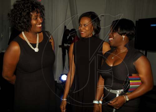 Colin Hamilton/Freelance Photographer
 Charmaine Harrison of Great Vacations (from left) chats with Marjorie Allen from Interiors by Design and Megan Deane from EXIM Bank. 

Thriller in celebration of Michael Jackson, put on by National Commercial Bank on July 1 at Pure.