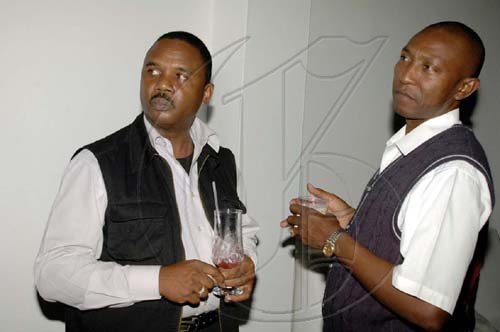 Colin Hamilton/Freelance Photographer

Is he my brother? Something has caught the attention of Anthony Cameron (left) and Leroy Watson, who look a lot alike.   

Thriller in celebration of Michael Jackson, put on by National Commercial Bank on July 1 at Pure.
