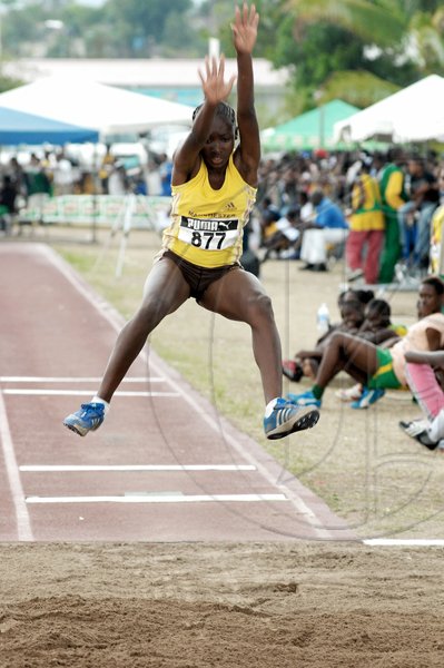 Ian Allen/Staff Photographer
Chanice Porter of Manchester High in full flight during the girls Class Three long jump on yesterday's opening day of the Milo-sponsored Central Track & Field Championships at GC Foster College. Porter leapt a record 6.10m