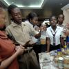 Ian Allen/Staff Photographer
Marcia Clarke (right), teacher at Linstead Primary shows some of the different samples of syrups the school had on display during the Jamaica Public Service Science and Technology Expo 2009 at the Knutsford Court Hotel in Kingston yesterday. Linstead Primary took home sectional prizes.