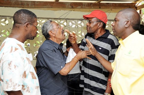 Ian Allen/Staff Photographer
Things nearly got ugly when it was discovered that there  were too many observers for the candidates in the voting area, elections director Noel Lee left and former JAS president senator Norman Grant tried to quell the disturbance.
