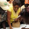 Ian Allen/Staff Photographer
Delegates of the Jamaica Agricultural Society(JAS) register to cast thier ballots in the JAS ellections at the Denbigh Showground on wednesday.