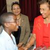Rudolph Brown/Chief Photographer
Gloria Millwood presents Jordan Salmon of Mona Prep school with second prize trophy of the Lay Magistrates Association of Jamaica  National Essay competition 2009 at Holy Cross Church Hall, 17 Half Way Tree Road in Kingston on Wednesday, June 17-2009