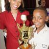 Rudolph Brown/Chief Photographer
Happy mother, Diane Hitchener smile with her son Timothy Hitchener of Our Lady of the Angels Prep school after he receive the winning trophy of the Lay Magistrates Association of Jamaica  National Essay competition 2009 at Holy Cross Church Hall, 17 Half Way Tree Road in Kingston on Wednesday, June 17-2009