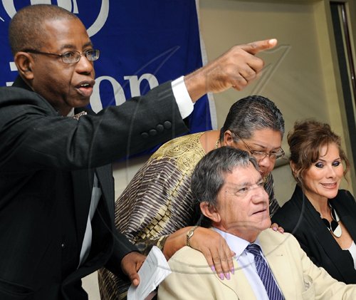 Rudolph Brown/Chief Photographer
Theo Campbell, Chairman, Positive Tourism Network answer question from the audiences while Aloun N?Dombet Assamba chat with Frank Rosheuvel, General Manager of Hilton Hotel and Senora Leonora Rueda, Mexican Ambassador to Jamaica at the Caribbean Veggie Fest Spa and Wellness Conference 2009 at the Hilton Hotel in New Kingston on Friday, June 12-2009