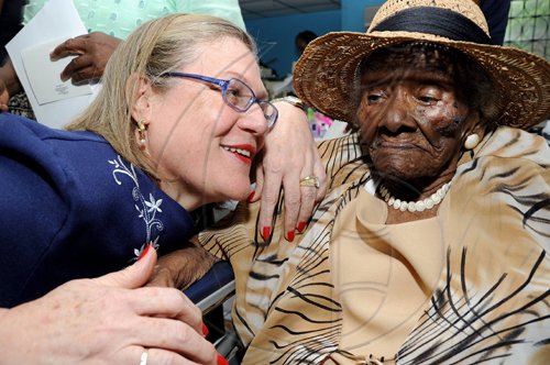 Rudolph Brown/Chief Photographer
Professor Denise Eldemire- Shearer, (left) Patron of the National Council for Senior Citizens chat with Centenarian Daisy Bennett 106 Year Old at the National Council for Senior Citizens, Ministry of Labour and Social Security presents Centenarians' Day celebration and intergeneration Day at the National Council in Kingston on Wednesday, May 20-2009