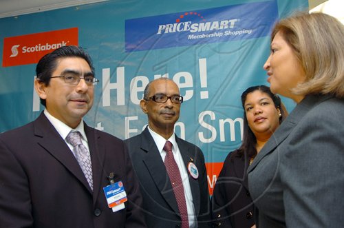 Rudolph Brown/Chief Photographer
Diana Forti, (right) Vice President and Customer Business Lead for Scotiabank in discussion with Pedro Vera, (left) Vice President of Operations of PriceSmart, Wayne Powell, (second left) Executive Vice President Branch Management Scotiabank and Elena Villafana-Sylvester, Financial Services and Retail Banking at the Scotiabank PriceSmart Diamond MasterCard Credit card launch at Knutsford Court Hotel in New Kingston on Tuesday, March 24-2009