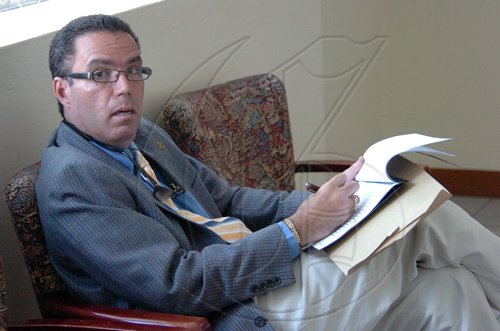 Rudolph Brown/Chief Photographer
Daryl Vaz, sits out in the lobby at Parliament on Tuesday, March 24-2009 after winning the Buff Bay, Portland by election, he will of to sits in the lobby or the in the Box until next week.