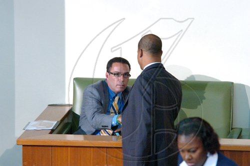 Rudolph Brown/Chief Photographer
Peter Bunting, PNP general secretary shake Daryl Vaz, hand at Parliament on Tuesday, March 24-2009 after winning the Buff Bay, Portland by election, Vaz will of to sit in the lobby or the in the Box until next week.