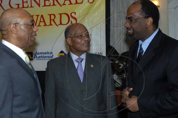 Ian Allen/Staff Photographer
His Excellency Dr.Patrick Allen left, Governor General of Jamaica raps with former Governor General Professor Kenneth Hall centre and Earl Jarrett right, Managing Director of Jamaica National Building Society while attending the Governor General's Achievement Awards Scheme Luncheon at the Terra Nova Hotel on wednesday.