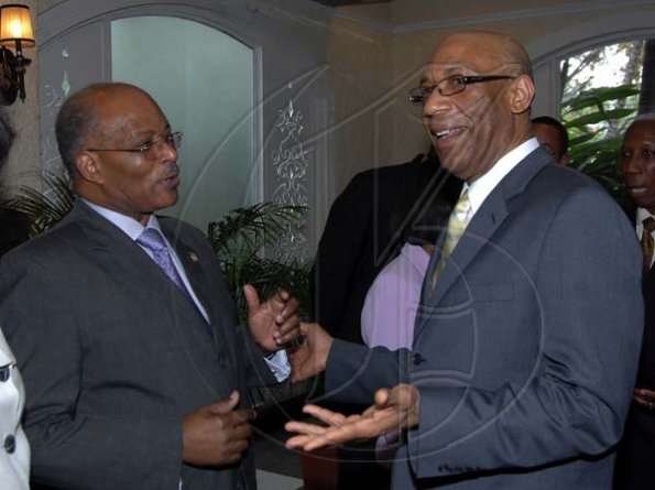 Ian Allen/Staff Photographer
His Excellency Dr.Patrick Allen right, Governor General of Jamaica a greets former Governor General Professor Kenneth Hall attending the Governor General's Achievement Awards Scheme Luncheon at the Terra Nova Hotel on wednesday.