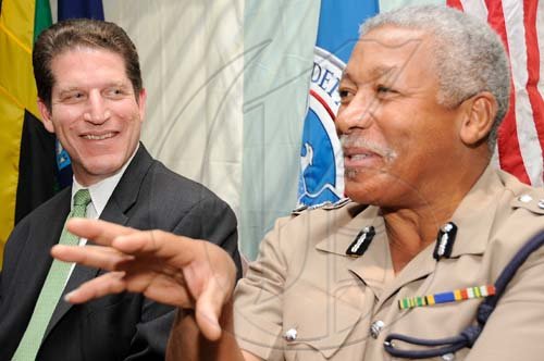 Rudolph Brown/Chief Photographer
Commissioner of Police Rear Admiral Hardley Lewin, (left) and Scott Hottfield of ICE speaks to members of the media during a press conference at the Hilton Hotel in New Kingston on Wednesday, May 27-2009