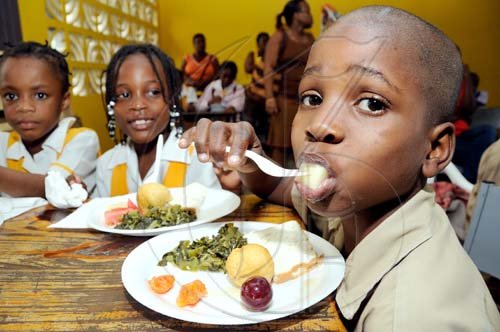 Rudolph Brown/Chief Photographer
Natasha Four, (centre) and Nesha Francis, (left) Jevane Chambers, (right) eating their breakfast at the Scotia Foundation Breakfast Feeding Programme launch at the Whitfield All Age School, 20 Whitfield Ave. in Kingston on Wednesday, May 27-2009, Scotia Foundation supports a Breakfast Feeding Programme for 600 Kids in five (5) schools across Jamaica at a cost of $2million.  The schools include Bamboo Primary and Junior High, St. Ann, Holy Family Primary and Infant School, Kingston,  Whitfield All Age School, Kingston, Drapers All Age School, Portland and Norwich Primary, Portland.