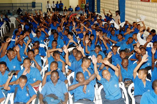 Ian Allen/Staff Photograper
Second form students of Jamaica College wave their hands in fellowship during a Gospel crusade at the school in St Andrew yesterday.