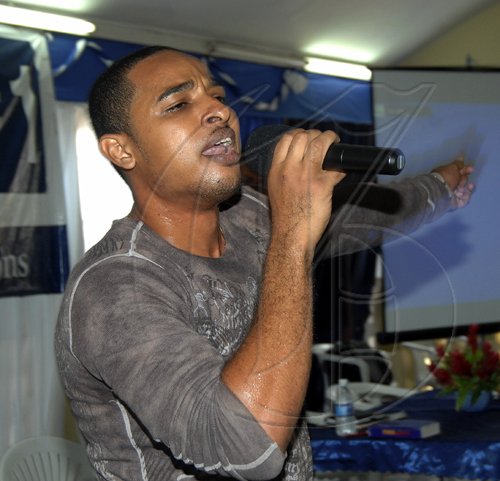 Ian Allen/Staff Photograper
DJ Nicholas Minister to second formers of Jamaica College during a Gospel Crusade at the school on thursday.