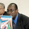 Ricardo Makyn/Staff Photographer.
From left Foreground Captain Lincoln Thaxter Principal,Calabar High School look on as Ruel Reid Principal Jamaica College holds up a flyer also looking on is Everton Burrell Acting Principal Kingston College at  the launch of the Schools' Peace Initiative for the 2009 ISSA/Grace Kennedy Boys' and Girls' Championships at the Jamaica College on Thursday 26.3.2009.