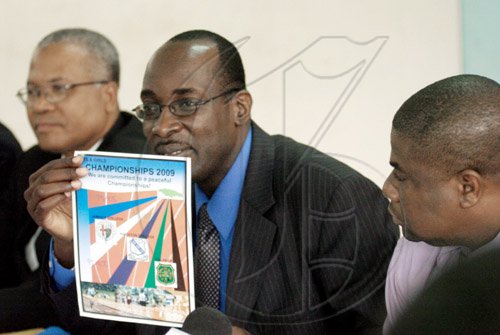 Ricardo Makyn/Staff Photographer.
From left Foreground Captain Lincoln Thaxter Principal,Calabar High School look on as Ruel Reid Principal Jamaica College holds up a flyer also looking on is Everton Burrell Acting Principal Kingston College at  the launch of the Schools' Peace Initiative for the 2009 ISSA/Grace Kennedy Boys' and Girls' Championships at the Jamaica College on Thursday 26.3.2009.