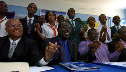 Ricardo Makyn/Staff Photographer.
From left Foreground Captain Lincoln Thaxter Principal,Calabar High School,Ruel Reid Principal Jamaica College,Everton Burrell Acting Principal Kingston College with Students from Mona  High School,The Queens School,Jamaica College,Kingston College,St Hugh's High School  and Calabar High School hold hands to signify the Peace at the launch of the Schools' Peace Initiative for the 2009 ISSA/Grace Kennedy Boys' and Girls' Championships at the Jamaica College on Thursday 26.3.2009.