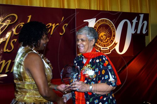 Winston Sill / Freelance Photographer
Shirley Maynier-Burke (right) gleefully accepts her award from the Wolmer's Girls' Alumnae president Dr Verna Reid.

Centenary Dinner, Dance and Awards Banquet, held at the Jamaica Pegasus Hotel, New Kingston on Friday night April 24, 2009.