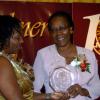 Winston Sill / Freelance Photographer
Dr Verna Reid (left), president of the Wolmer's Girls' Alumnae  presents Olga Geoghagen with her award as one of the eight women honoured at the Centenary Dinner, Dance and Awards Banquet, held at the Jamaica Pegasus Hotel, New Kingston on Friday night April 24, 2009.