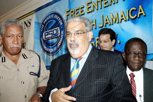 Winston Sill / Freelance Photographer
Jamaicans For Justice (JFJ) and the Private Sector Organization of Jamaica (PSOJ) public forum on Police Reform, held at Knutsford Court Hotel, Ruthven Road on Wednesday July 29, 2009. Here are Rear Admiral Hardley Lewin (left), Commissioner of Police; Derrick Jones (second left), Moderator; Joseph M. Matalon (second right), President of PSOJ; and Senator Dwight Nelson (right), Minister of National Security.