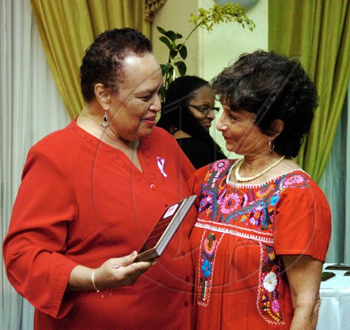 Peta-Gaye Clachar/Staff Photographer
Hillary Nicholson (right), makes a presentation to Barbara Gloudon, for her contribution to Jamaica.
******************************************************************************************************


 at the Tribute to Women Trailblazers and Launch of Women's Media Watch-Jamaica 21st anniversary celebrations at the Hilton Kingston Jamaica on Tuesday, March 3, 2009.