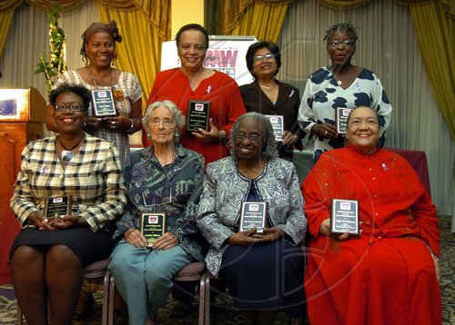 Peta-Gaye Clachar/Staff Photographer
Blazing a trail. Fourteen women were honoured for their contribution to Jamaica through their work. From left seated  Paula Llewelyn, Cynthia Wilmot, Carmen Stewart and Syringa Marshall Burnett. From left standing, Lana Finikin, Barbara Gloudon, Jean Lowrie-Chin and Linette Vassell. Absent were Barbara Bailey, Helene Davis Whyte, Zailia McCalla, Portia Simpson Miller, Evelyn Smart and Ionie Worms.   





Honourees pose for a photographic moment at the tribute to women trailblazers and launch of womens media watch Jamaica 21st anniversary celebrations at the Hilton Hotel on Tuesday, March 3, 2009.From left (front rowe) is DPP Paula Llewelyn,Cynthia Wilmot,Bishop Carmen Stewart, Mrs. Syringa Marshall, (back rowe) Lana Finikin, Mrs. Barbara Gloudon, Mrs. Jean Lowrie-Chin and Linette Vassell.