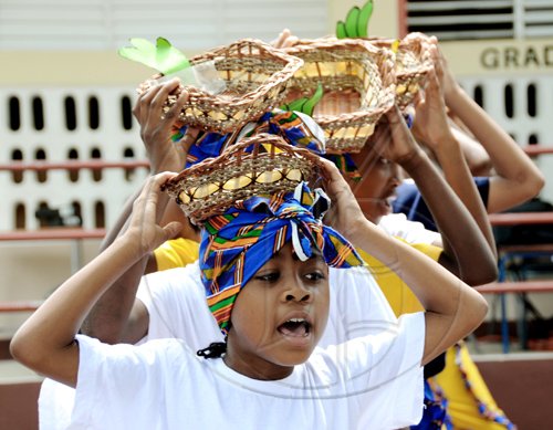 Ricardo Makyn/Staff Photographer.
Members of the Junior Culture Club perform a folk medley during the ceremony for the renaming of the Gordon Town All-Age School to the Louise Bennett-Coverley All Age yesterday





on Thursday 4.6.2009.