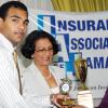 Rudolph Brown/Chief Photographer
Janille Maragh, (right) student of Campion College walk away with all Island Champion Student, Insurance Association of Jamaica, Vivian Rochester Memorial Mathematics competition top trophy after Karen Rochester, (centre) wife of the late Vivian Rochester and son Lance Rochester make the presentation to her at the Hilton Hotel in New Kingston on Friday, June 5-2009.