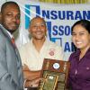Rudolph Brown/Chief Photographer
Nikolaus Price, (left) of Sagicor Life Jamaica presents Janille Maragh, and her math teacher Kesang Chinstudent of Campion College with all Island Champion School, Insurance Association of Jamaica, Vivian Rochester Memorial Mathematics competition top trophy at the Hilton Hotel in New Kingston on Friday, June 5-2009.