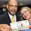 Rudolph Brown/Chief Photographer
Derick Latibeaudiere, Governor of BOJ look at $5000 Banknote with Professor Denise Eldemire-Shearer after presents the note to her at the launch of the $5000  Banknote bearing Former Prime Minister Hugh Shearer at the Bank of Jamaica in Kingston on Monday , May 18-2009.