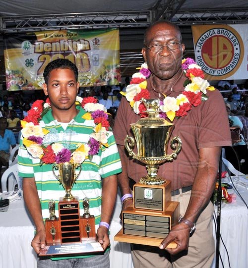 Contributed                                                                             2010 Junior Champion Farmer, Rahim Baccas (left) and 2010 Champion Farmer,
Errol Pickney, show off their winning trophies at the Denbigh Agri-
Industrial Show yesterday (August 1) in May Pen, Clarendon.
