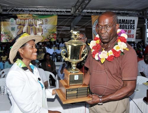 Contrbuted                                                                            Her Excellency the Most Hon. Lady Allen, presents the 2010 Champion Farmer
trophy to  Errol Pickney, yesterday (August 1) at the Denbigh Agri-
Industrial Show in May Pen, Clarendon.