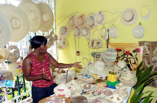Norman Grindley/Chief Photographer
Charline Graham looks over the varierty of goods on sale at her booth at the Denbigh Agri-Industrial Show in Clarendon on Sunday.