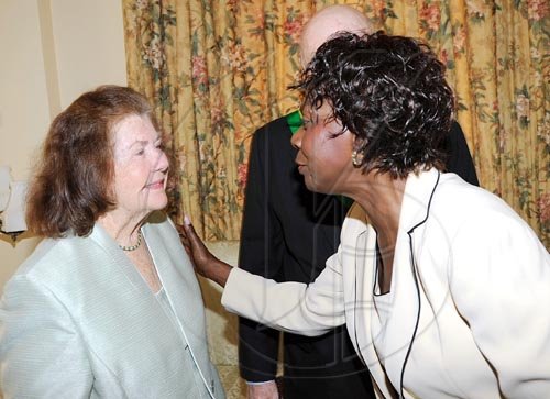 Rudolph Brown/Chief Photographer
Lorna Golding, (right) wife Prime Minister Golding chat with Peggy Blade wife of Desmond Blade chairman of General Accident Insurance Company after the Governor General Dr. Patrick Allen invested the Order of Jamaica on Mr. Blade during a ceremony of investiture and presentation of National Honours and Award at Kings House, St Andrew on Tuesday. May 12-2009